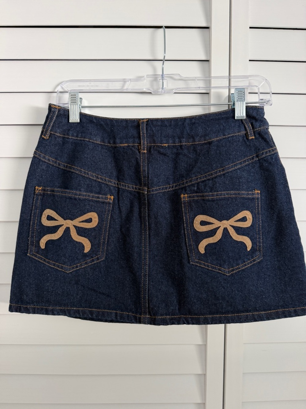 Altar'd State Dark Blue Denim Mini Skirt with Tan Bow Pockets